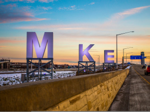 big MKE letters by airport, sunrise