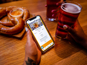 hand holding cellphone displaying lakefront brewery on the brew city beer pass