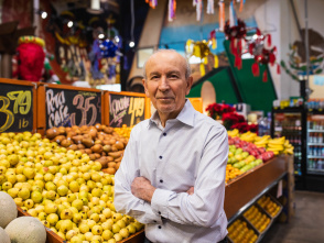 headshot of an older hispanic gentleman in a grocery store produce aisle