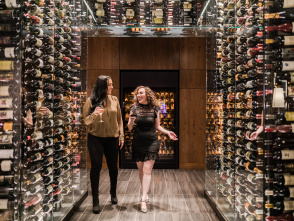 two women with wine walking in "wine tunnel"