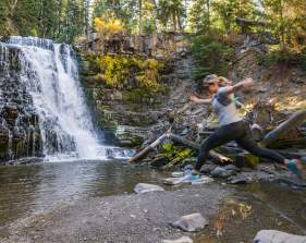 Girl Jumping at Ousel Falls