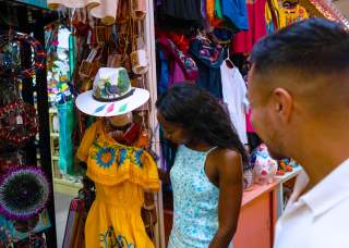 Man and woman shopping and looking at clothes