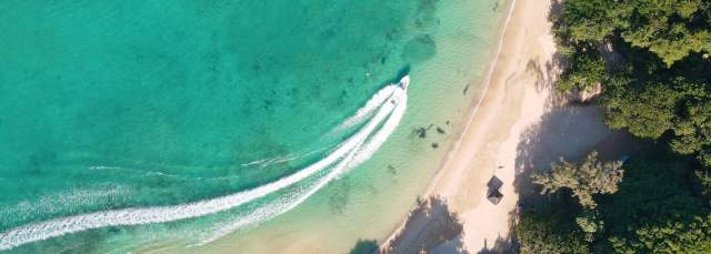 Aerial of boat & beach