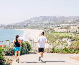 Two people running along the Strands to Salt Creek Beach trail