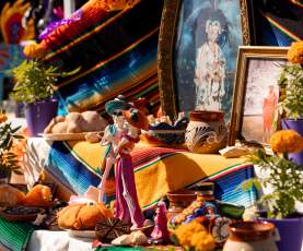 vibrant ofrenda, or altar, decorated with treasured mementos