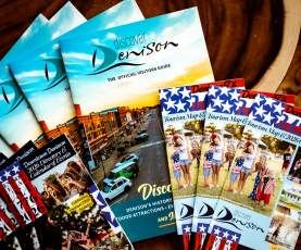 Visitor guides and tourism brochures available at the Discover Denison Visitor Center