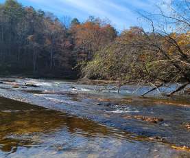 The sun reflects off the lake at Lost Lake Loop at Cahaba River Park.