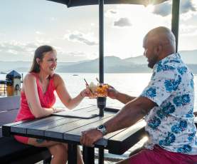 Couple with Cocktails at Lakeside Dining Patio Eldorado Resort