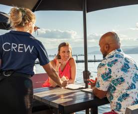 Couple Served Cocktails at Lakeside Dining Patio Eldorado Resort