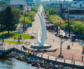 Apple Triathlon 2024 Athletes Running by Sails Sculpture Aerial