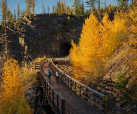 Couple Biking at Myra Canyon Trestles during Golden Larch Season 7