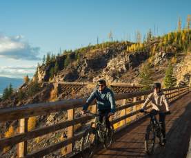 Couple Biking at Myra Canyon Trestles during Golden Larch Season 9