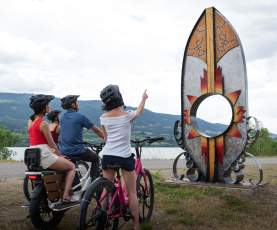 Family Viewing Indigenous syilx Artwork along Okanagan Rail Trail