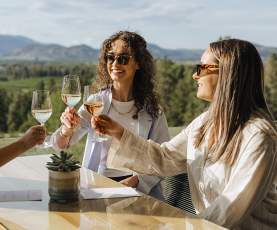 People toasting at Tantalus Vineyards.