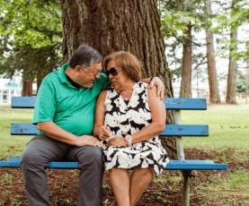 elderly couple on a park bench