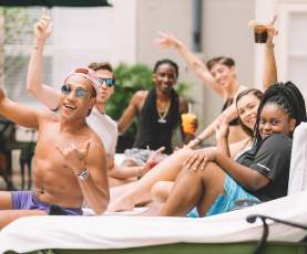 Group of friends enjoying the Bourbon Orleans pool
