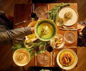 Traditional New Orleans Reveillon dinner at MaMou with seasonal dishes and warm holiday ambiance.