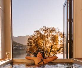 A lady enjoying the evening sunshine in a Driftaway Holiday Park Hot Tub