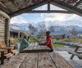 Guests enjoying a hot drink at Headwaters Eco Lodge, Glenorchy