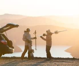 Friends unpack their car for a day of skiing at Treble Cone