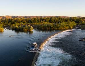 A car crossing the Ord River at Ivanhoe Crossing near Kununurra.