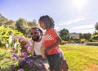 Man and child looking at flowers at Filoli Historic House and Garden