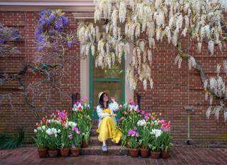 Woman enjoying the tulips at Fioli in Woodside California.
