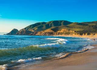 Waves hitting the sand on Montara State Beach in San Mateo County