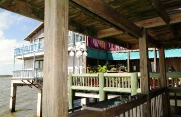 In Cedar Key, located three-miles out into the Gulf of America, you can enjoy a craft beer on the deck on the Black Dog.