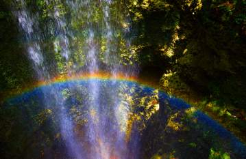 The mist and the afternoon sun combine for a rainbow in the waterfall at Falling Waters State Park near Chipley, Fla.