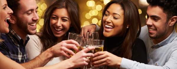 Group of adults toasting drinks