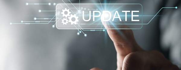 A man's finger with a graphic overlay reading, "Update"