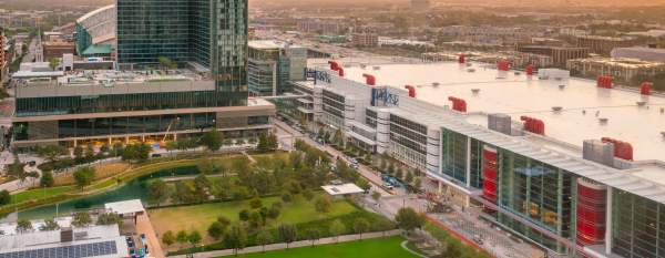 A large convention center integrated into the surrounding cityscape, illustrating how modern venues function as destinations within the broader urban experience.