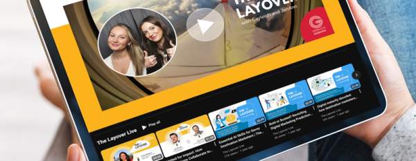 The main page of The Layover Live podcast with pictures of the hosts and a microphone.