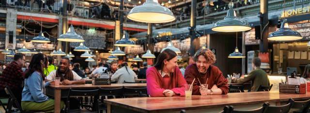 A couple enjoying drinks in Mackie Mayor