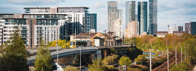 Skyline with train tracks leading into city centre with skyscrapers