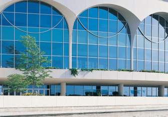 An external view of the large arched windows overlooking Lake Monona at Monona Terrace