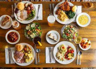 Birds eye view of plates of food set on a dining table
