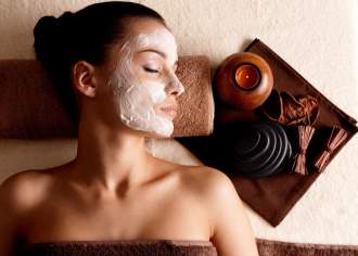 A women relaxing with facial spa treatment