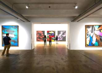visitor viewing art work inside museum