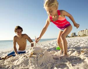 Kids building a sandcastle on Panama City Beach Florida