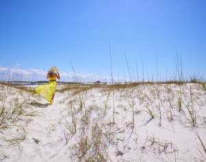 Girl walking on dunes