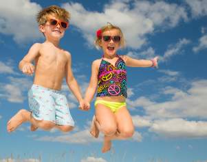 Kids Jumping on the beach