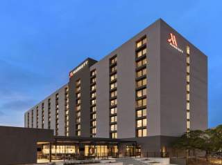 External view of hotel building with clear sky in background