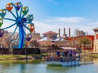 Overview of Morgan's Wonderland with ferris wheel and passenger boat