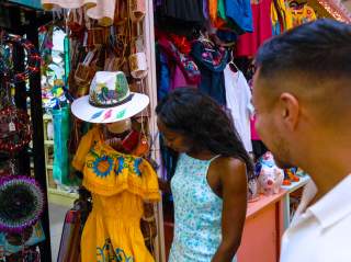 Man and woman shopping and looking at clothes