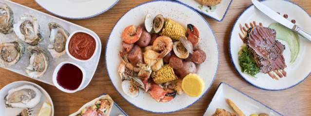 Fresh seafood and southern coastal classics are served at the waterfront restaurant Wharf on Jekyll Island, Georgia