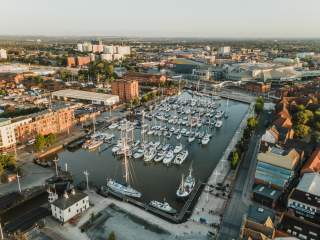 Hull Marina shot from above, showing many boats in the dock at sunset.