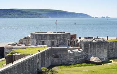 Exterior of Hurst Castle with the Isle of Wight and The Needles in the background in the New Forest
