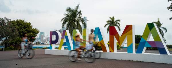 Biking on Cinta Costera, in the background Panama City skyline, Panamá